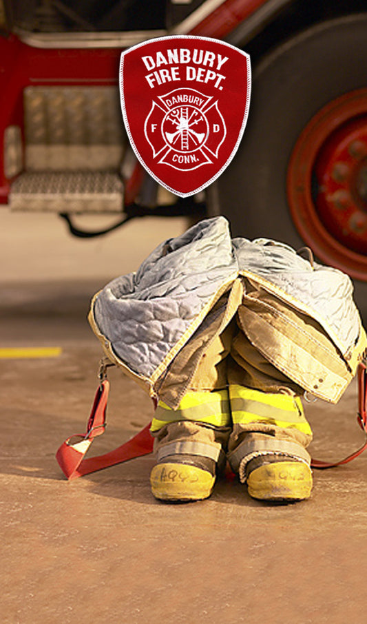 Fire Department’s Seal or Patch above Empty Boots