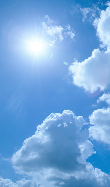 Bright Sun Light and White Fluffy Clouds