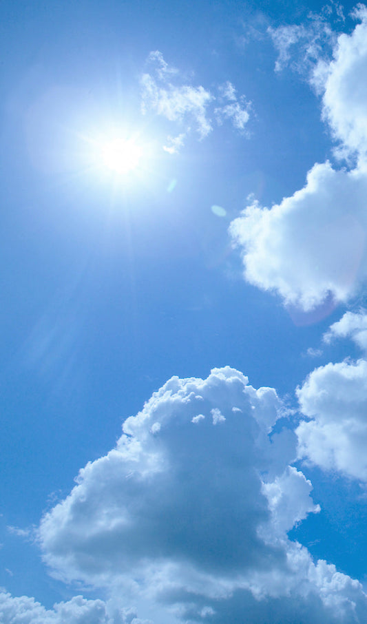 Bright Sun Light and White Fluffy Clouds